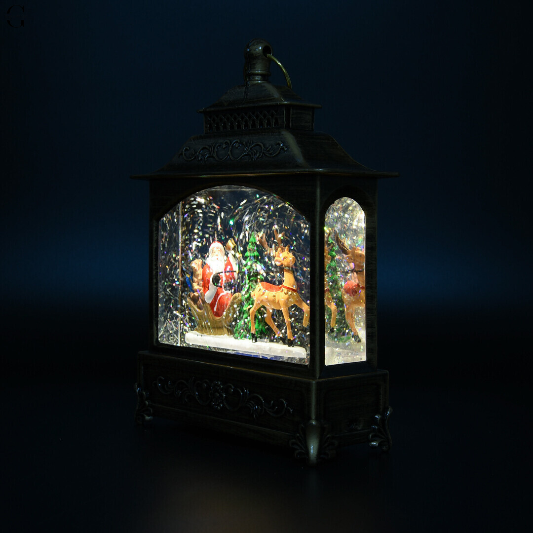 Рождественский музыкальный LED фонарь с блестками и фигурками 21×13.5 см от сети и батареек AT-D27A